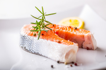 Salmon. Raw salmon steak with rosemary lemon salt and pepper