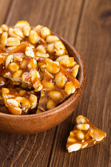 Bowl of homemade kozinaki made from peanuts