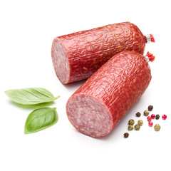 Salami smoked sausage, basil leaves and peppercorns isolated on white background cutout
