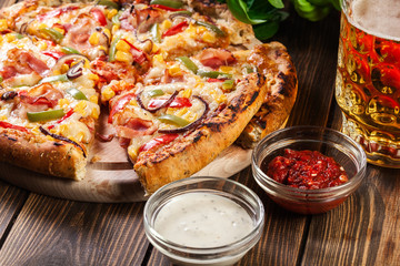 Homemade pizza with bacon, paprika and corn