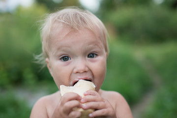 Happy funny child eating ice cream