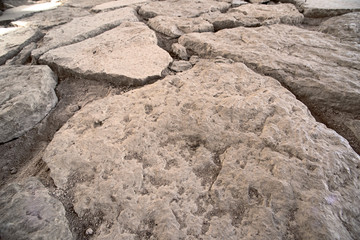 Road of old limestone paving stones, close