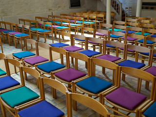 Simple wooden chairs in a church