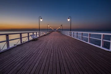 Papier Peint photo autocollant Jetée Amazing sunrise on the pier at the seaside. Gdynia Orlowo, Poland