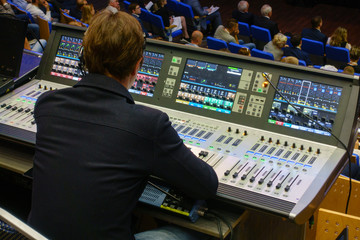 Video and audio engineer working at the event - obrazy, fototapety, plakaty