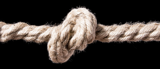 Ship rope with knot isolated on black background. With copy space text. Studio Shot.