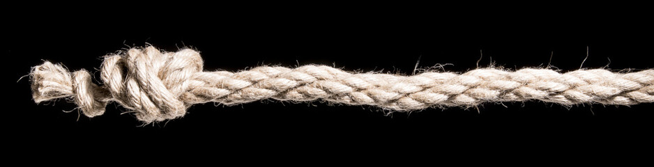 Ship rope with knot isolated on black background. With copy space text. Studio Shot.