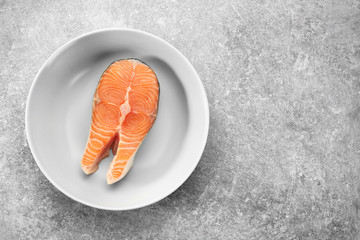 Fresh salmon steak in plate