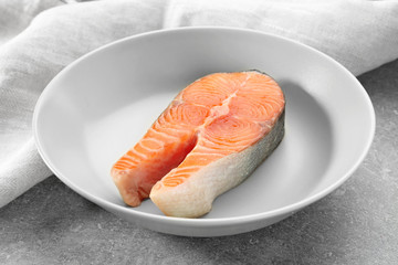 Fresh salmon steak in plate