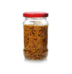 Glass jar of french mustard on white background
