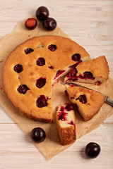 Home plum pie on baking paper.