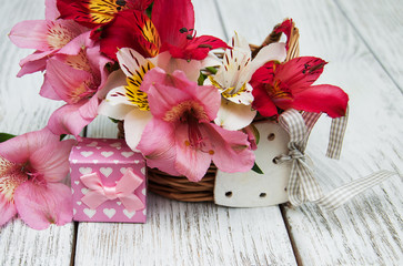 pink alstroemeria with gift box