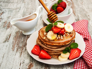 Pancakes with strawberries and bananas