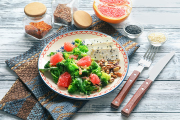Plate with broccoli salad on table
