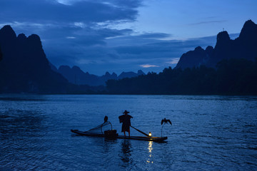 Fisherman and cormorant , Guangxi province, China