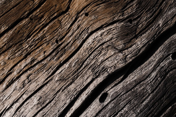 Fototapeta na wymiar old gray, rotten wooden board with large cracks