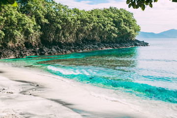 Tropical beach with blue ocean in Bali
