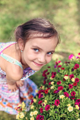 Smiling girl smiles flowers