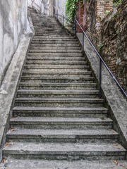 Fototapeta na wymiar Walkway, steep stairway going up to the Trsat Castle. Rijeka (Fiume), Croatia. HDR technique.