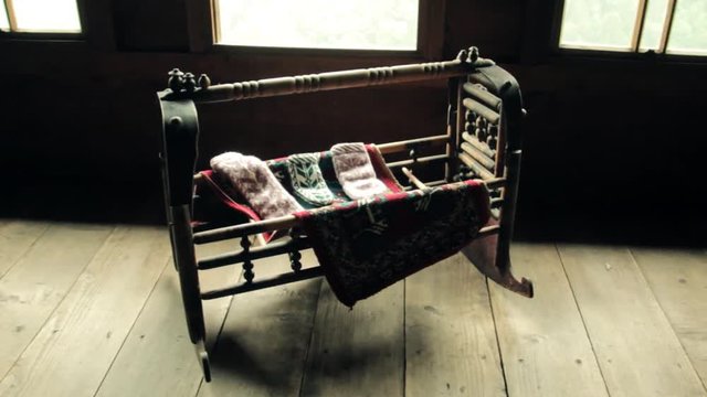 Wooden baby crib in the old village house