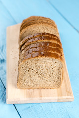 Toast bread slices on the wooden cutting board