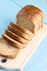 Toast bread slices on the wooden cutting board