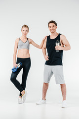 Fototapeta na wymiar couple with fitness shakers