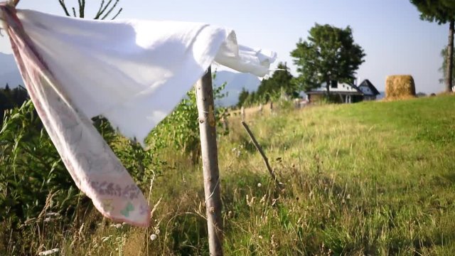 Rags hanged to dry in the sun at the mountainside
