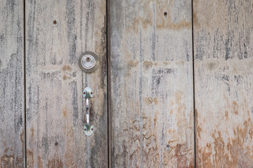 The key to the door on the old wooden floor.