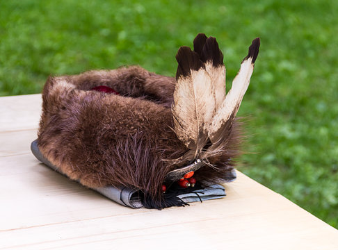 Traditional headdress fur nobleman's cap war is richly decorated with feathers and ornament