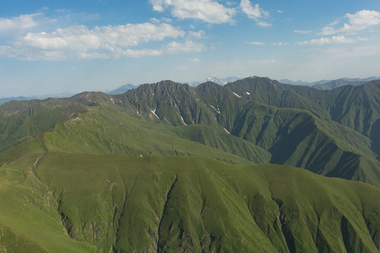 Fototapeta view from a helicopter flying over the mountains of Tusheti