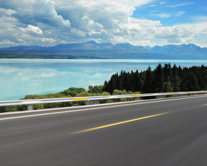 Asphalt road with Lake Pukaki background
