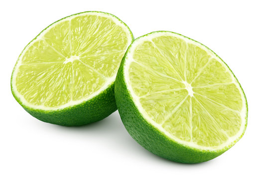 Two halves of green lime citrus fruit isolated on white background. Lime halves with clipping path