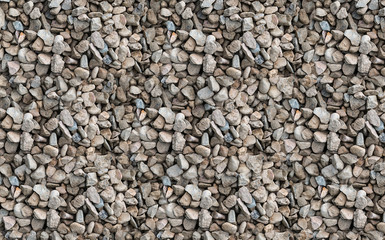 Stone dune mound of gray beige gravel industrial texture background