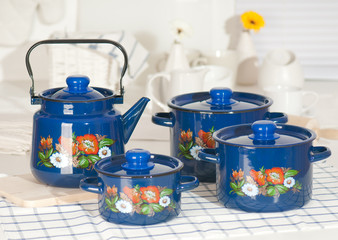 Kitchen utensil set of blue pots and kettle