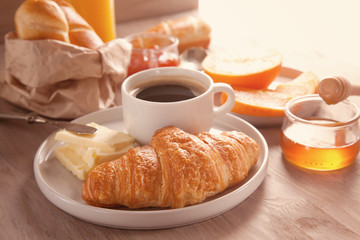 Breakfast with coffee, orange juice and croissant. Top view