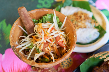 SOM-TAM, Thai delicious raw papaya salad with unique taste hot and spicy, this dish with tomato and crab.
