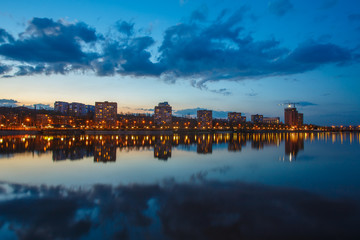 Night city reflection on the river