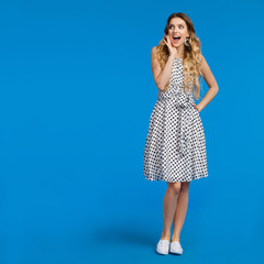 Happy Shouting Young Woman On Blue Background