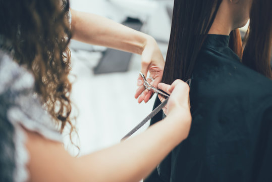 Stylist working in the beauty salon, haircut and hair styling