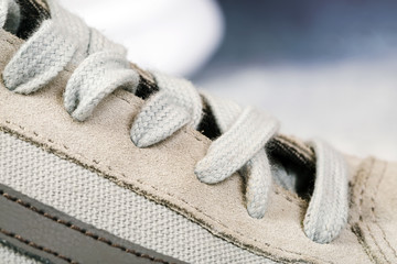 Fototapeta na wymiar Pair of men's sports shoes close up background