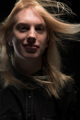 Young man with long blond hair