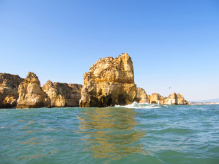 Fototapeta na wymiar Rock formations on the beach in Lagos, Portugal