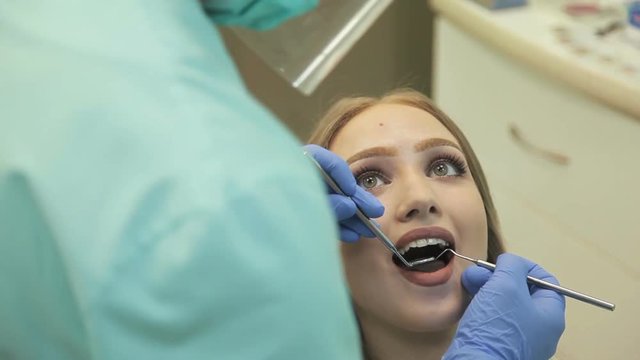 Dentist examining a patient's teeth in the dentistry
