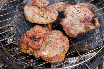 Chuck steak being grilled, outdoors