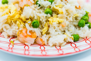 Homemade Chinese fried rice with vegetables and fried eggs
