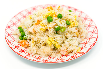 Homemade Chinese fried rice with vegetables and fried eggs