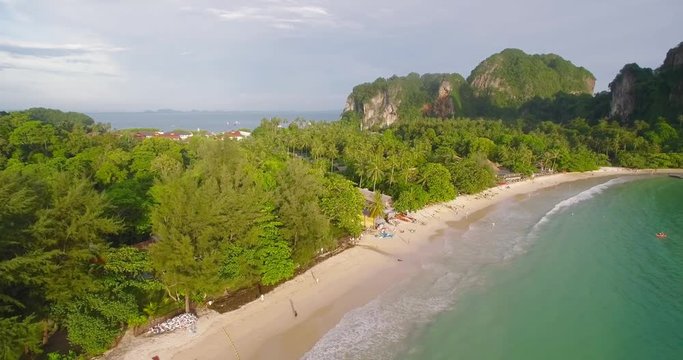 Karst Limestone Cliffs on Railay West Beach, Krabi, Thailand, Descending Aerial Shot With Pan
