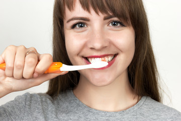 Woman gives a toothbrush