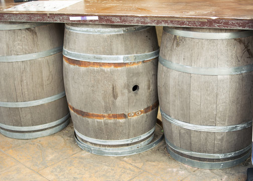 wine fermentation,Old wooden barrels and tanks for processing wine